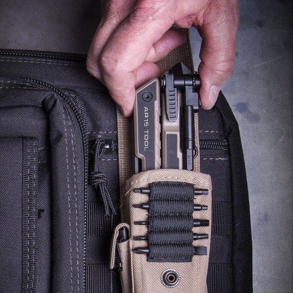 A tan multi tool on a black backpack with all the necessary tools to keep your AR15 running smooth!