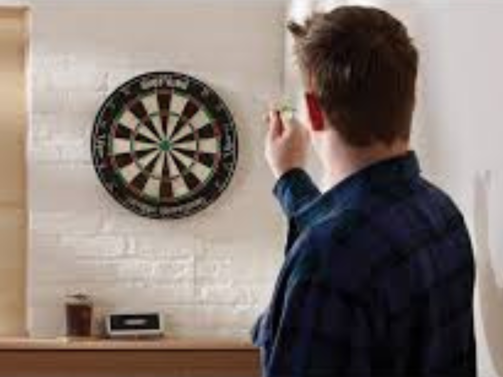 A man throwing darts