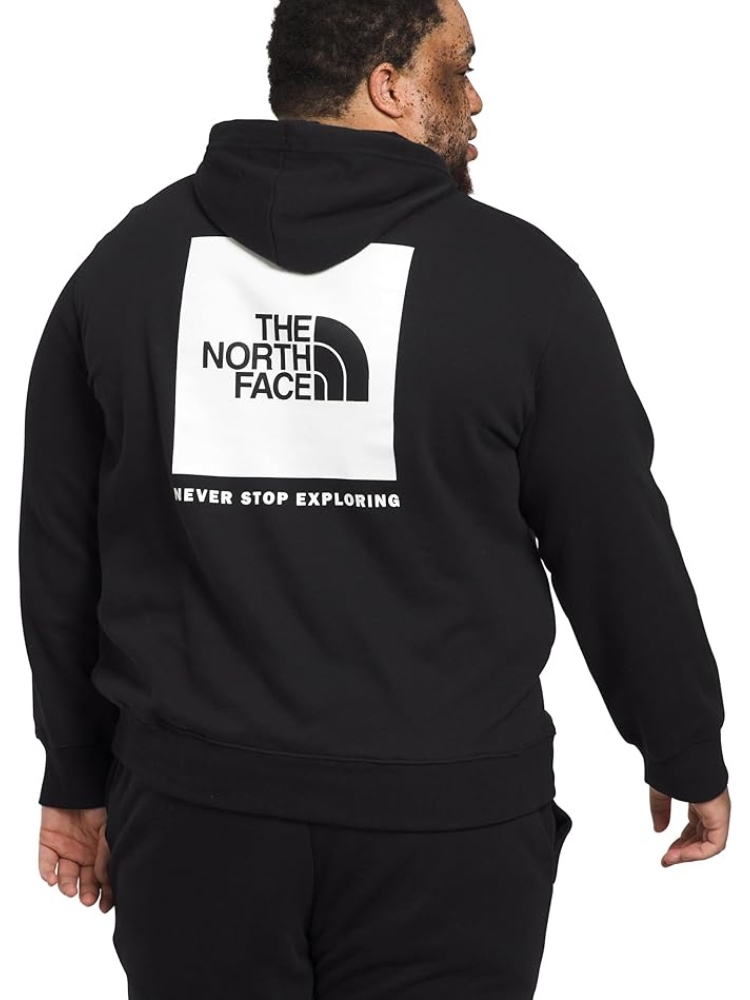 A large man wearing The North Face black hoodie viewed from behind.
